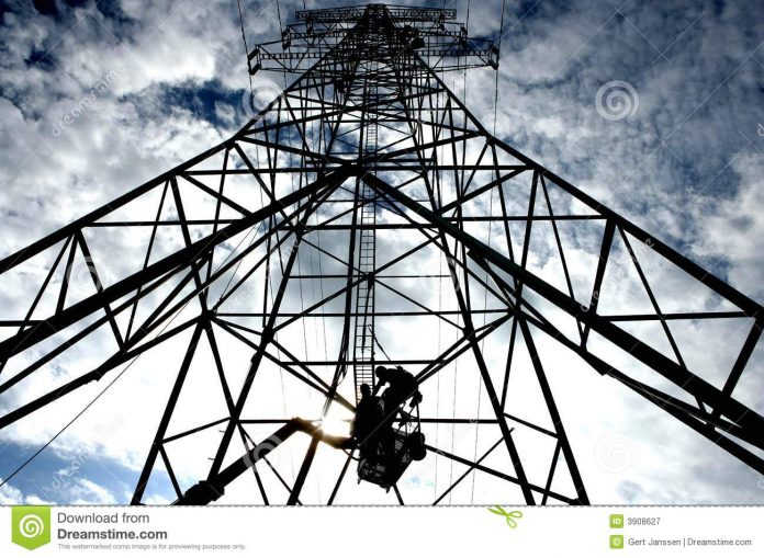 Electricity worker on a mast