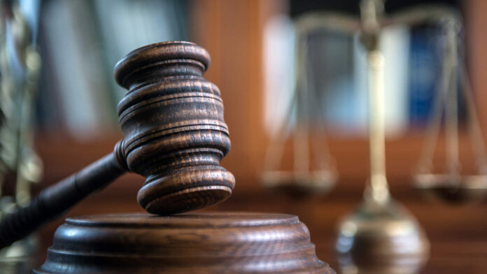 Law and Justice concept. Mallet of the judge, books, scales of justice.